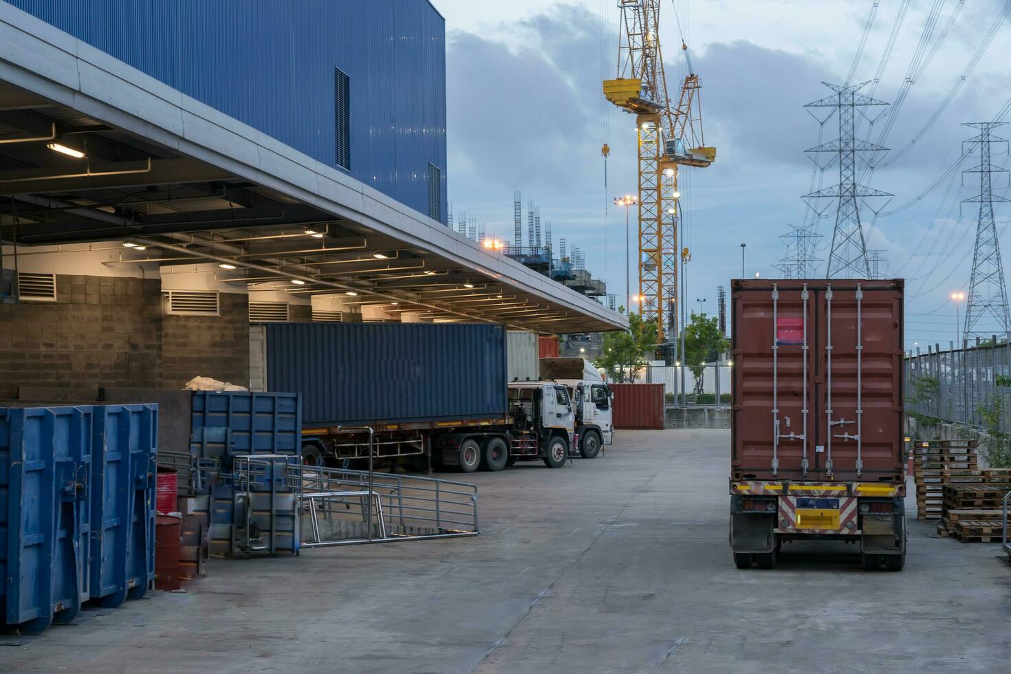 Truck is carrying container parking in front warehouse photo