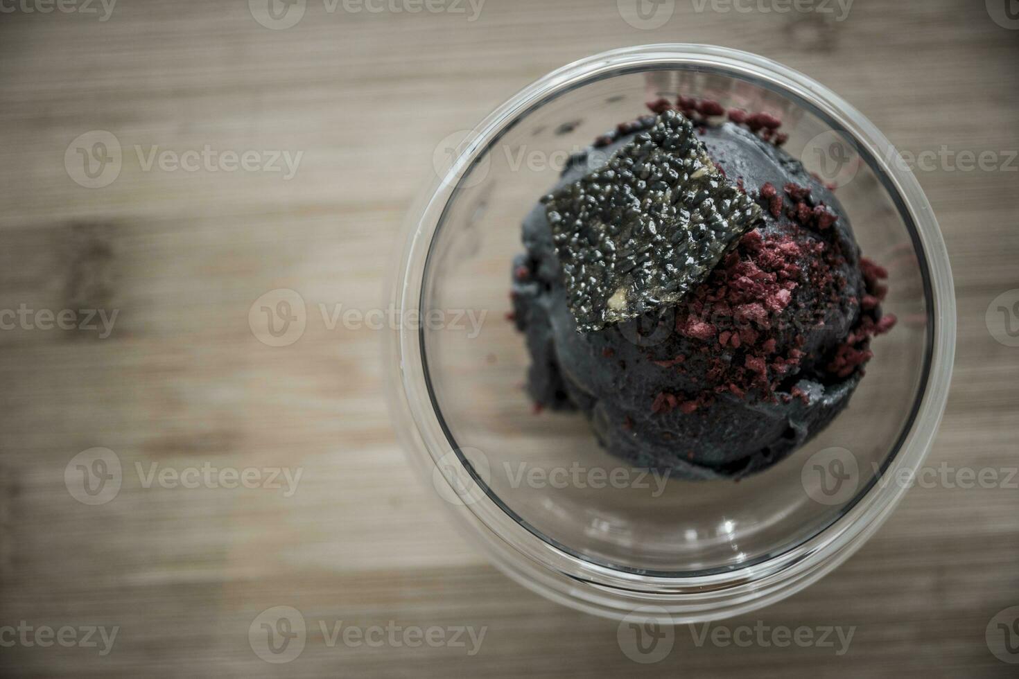 Bowl of tofu based ice cream with black sesame seed. photo