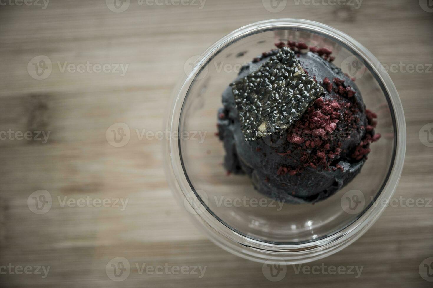 Bowl of tofu based ice cream with black sesame seed. photo