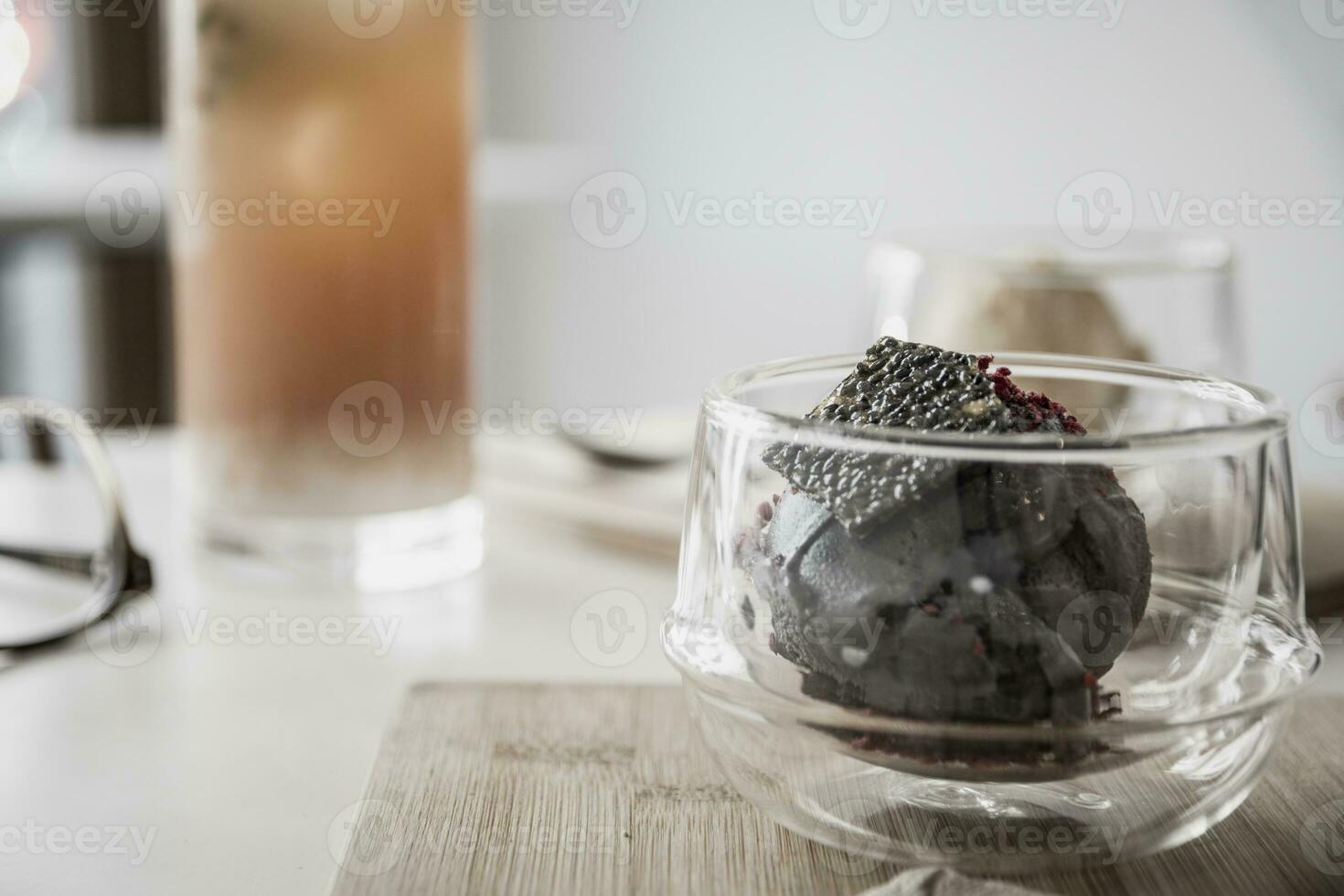 Bowl of tofu based ice cream with black sesame seed. photo