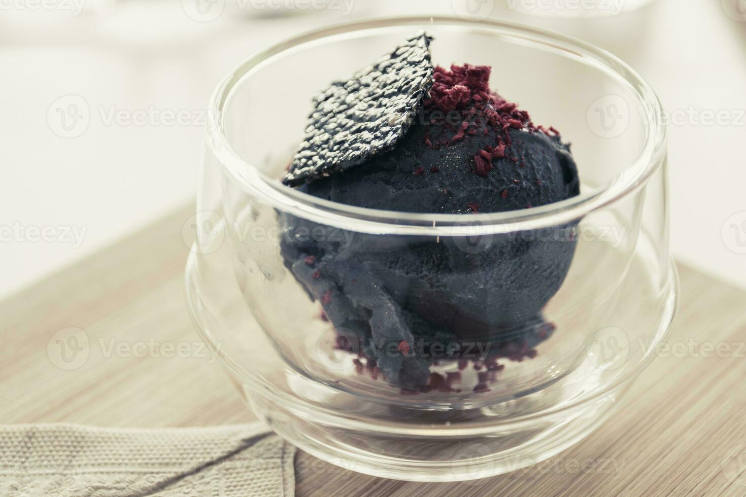 Bowl of tofu based ice cream with black sesame seed. photo