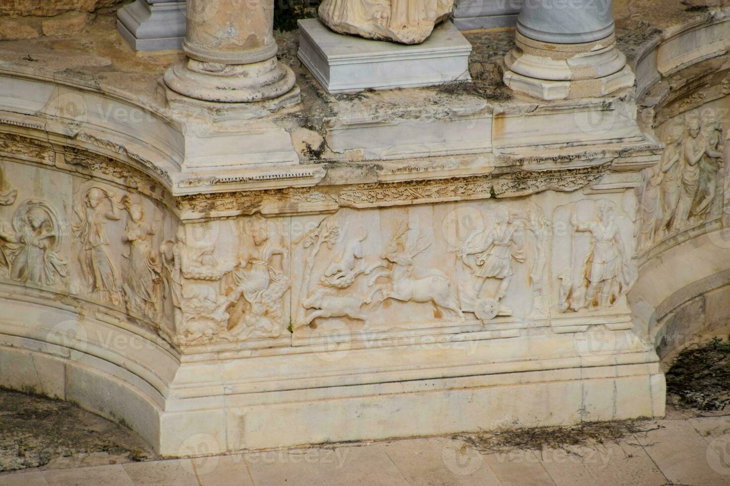 Bas-reliefs of antique scenes on the gables of the amphitheater in Hierapolis, Turkey. photo