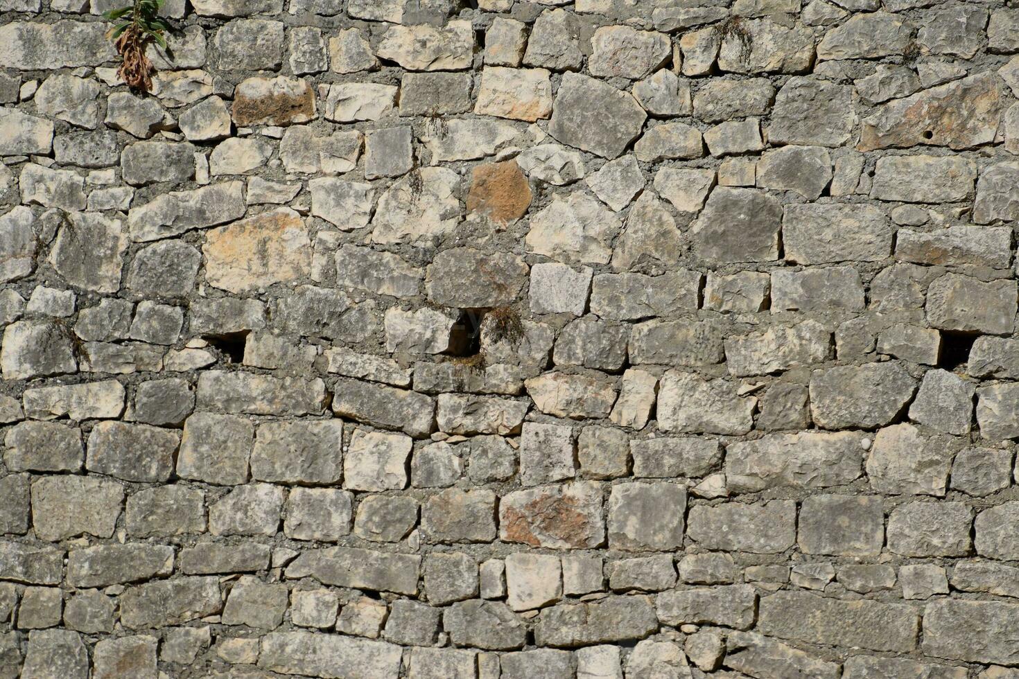 texture Stones and cement masonry walls. photo