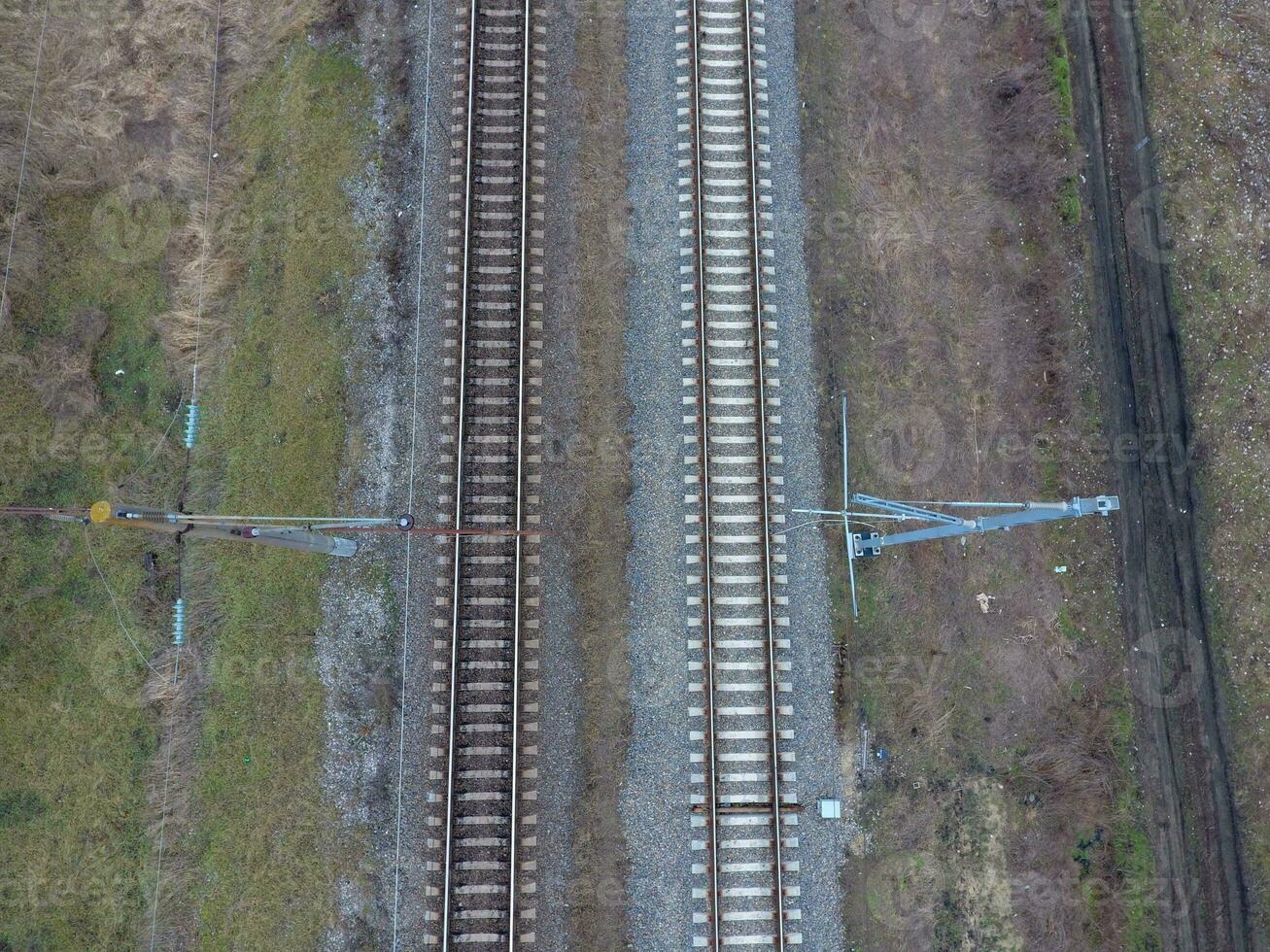 Plot railway. Top view on the rails. High-voltage power lines for electric trains photo