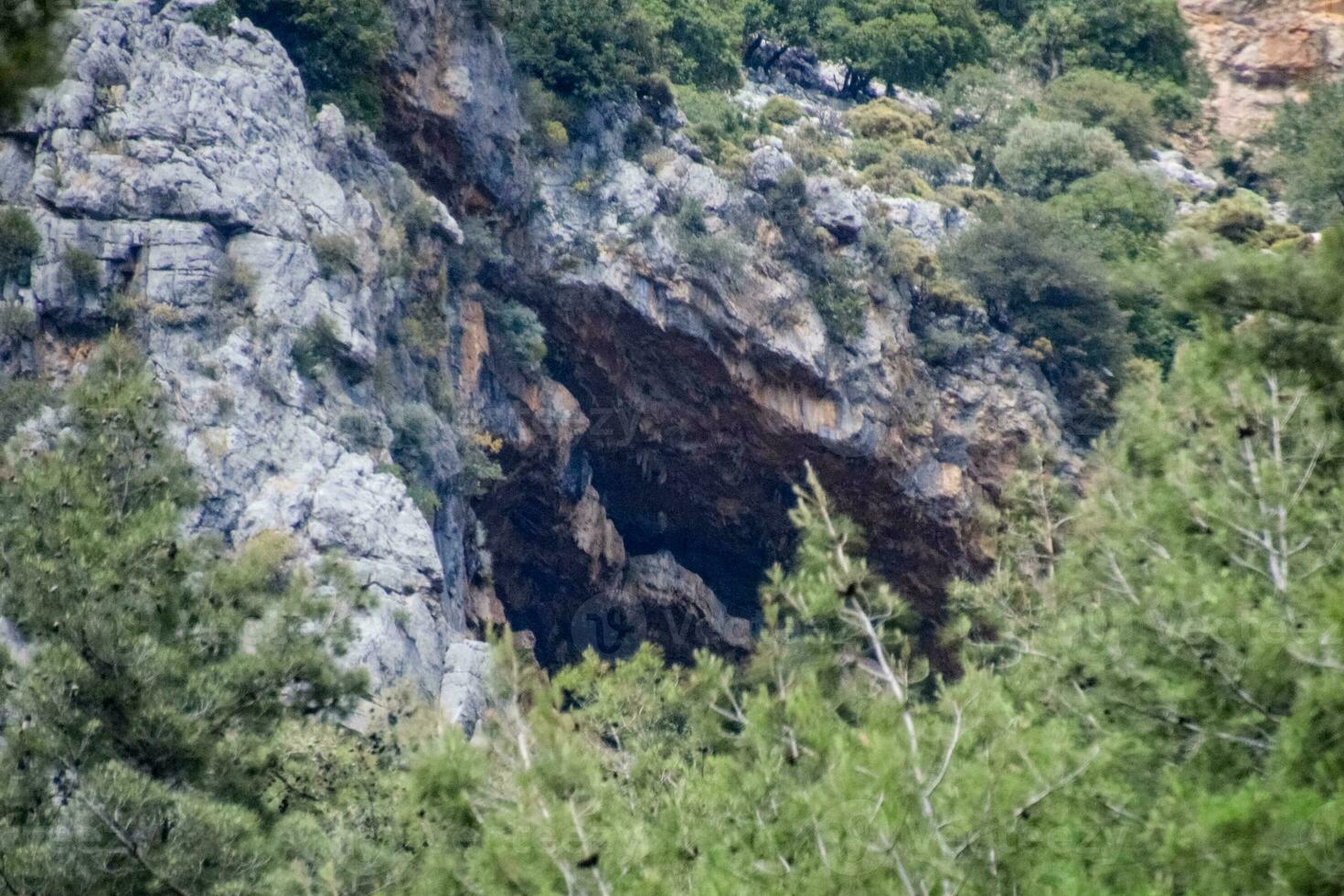 Caves in the limestone mountains. Void in rock mountain. photo