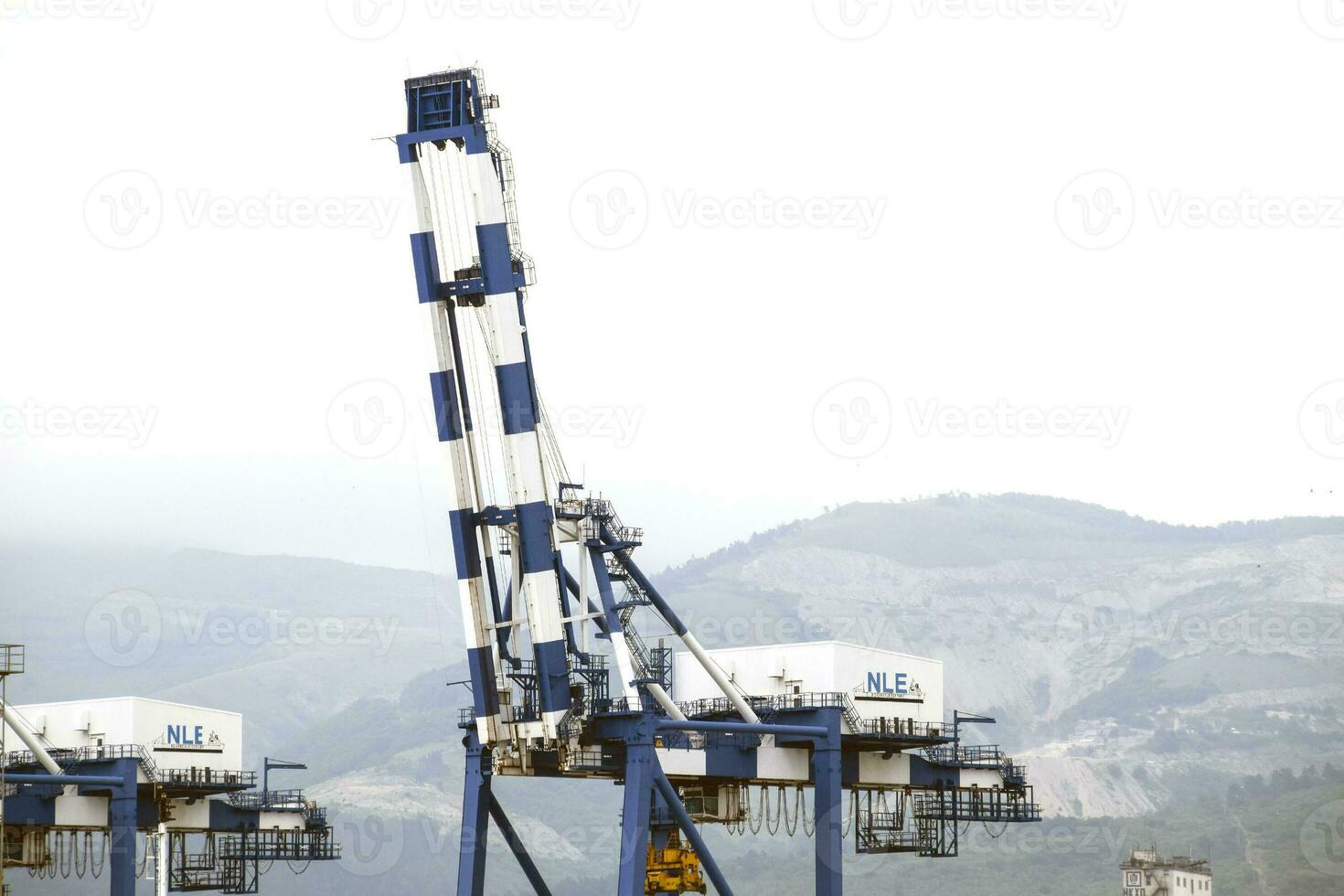 The international sea port of Novorossiysk. Port cranes and industrial objects. Marine Station. photo