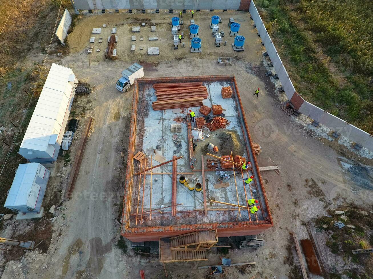 Construction of a brick building. Installation of the roof. Construction works. photo