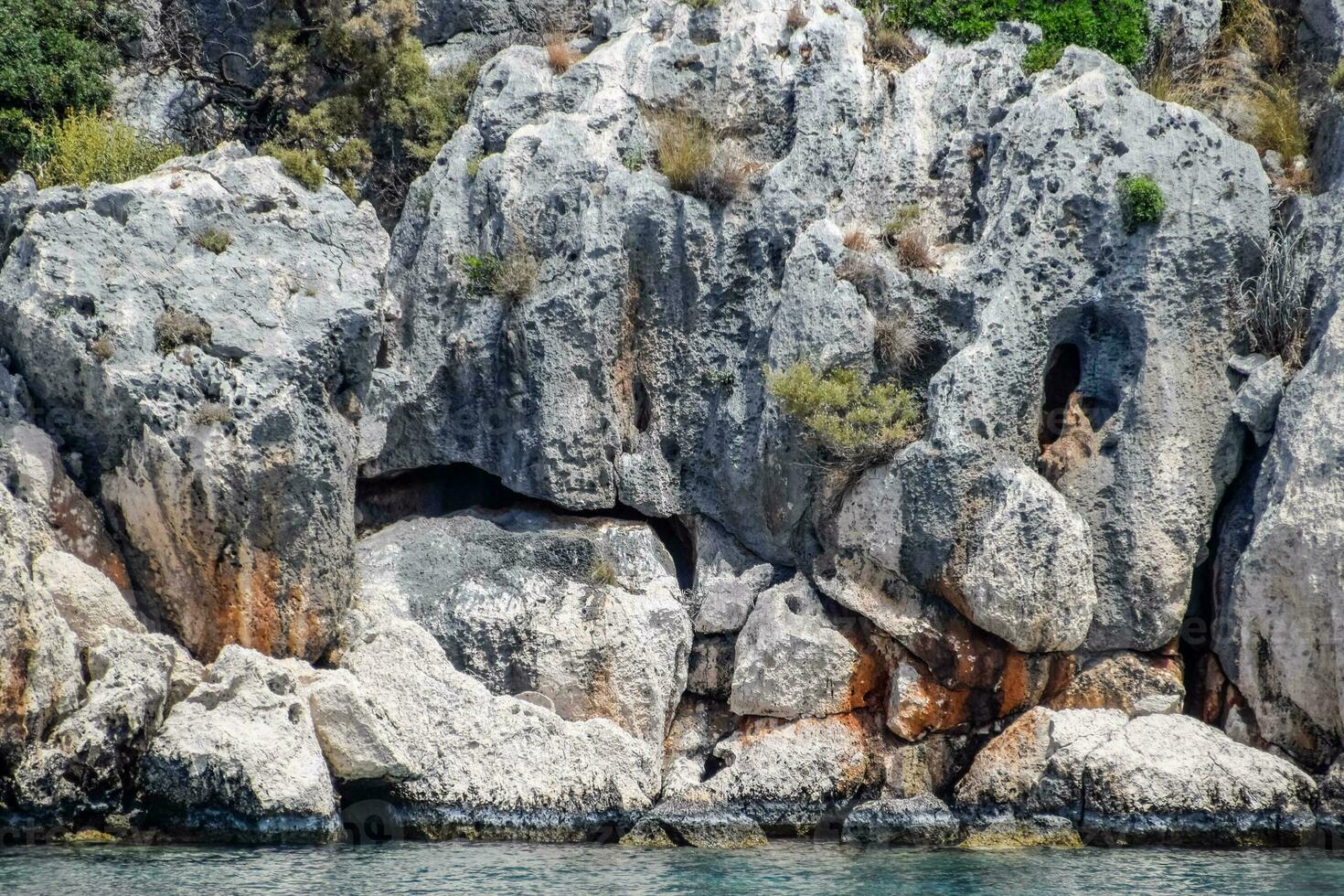 ruins of the ancient city of Kekova on the shore. photo