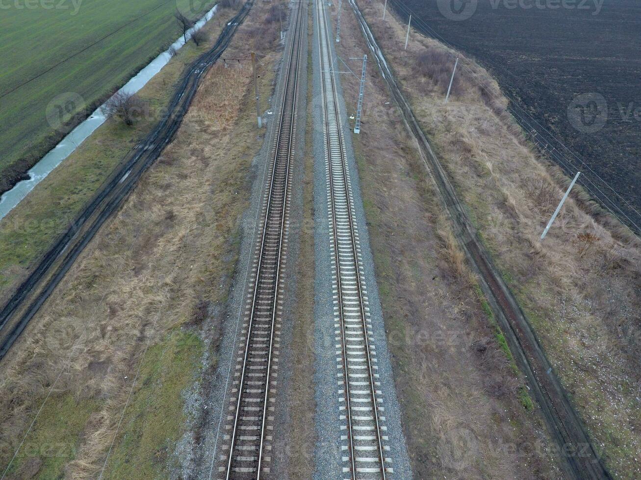 Plot railway. Top view on the rails. High-voltage power lines for electric trains photo