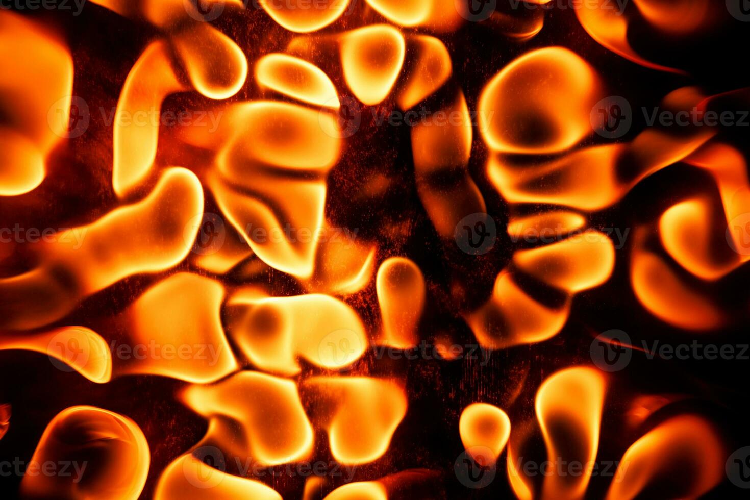 Beautiful liquid fire texture on black background photo