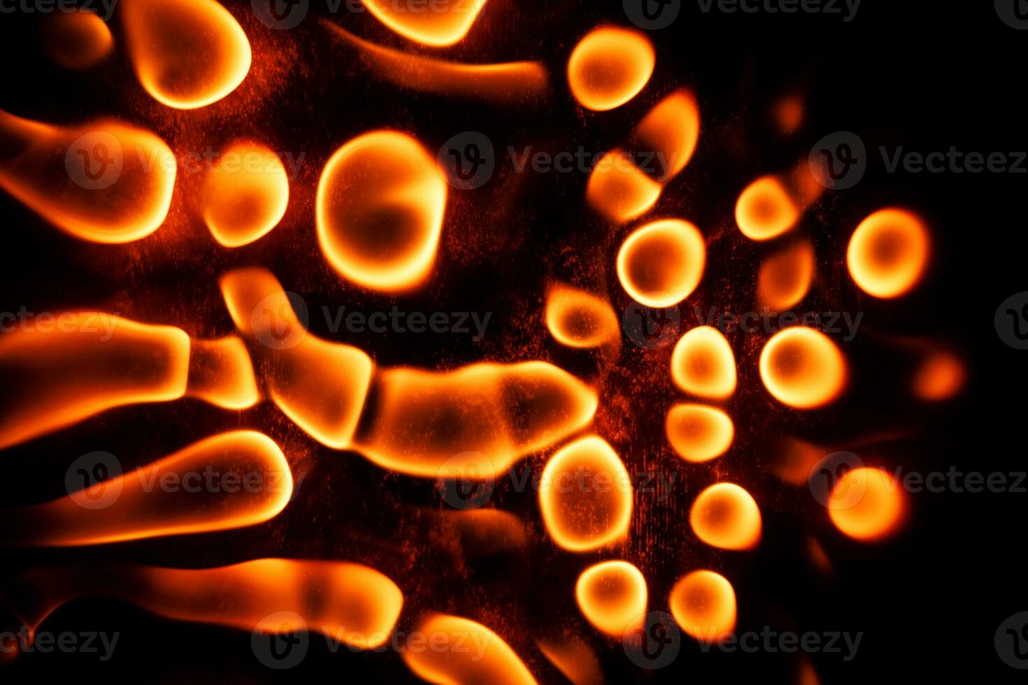 Beautiful liquid fire texture on black background photo