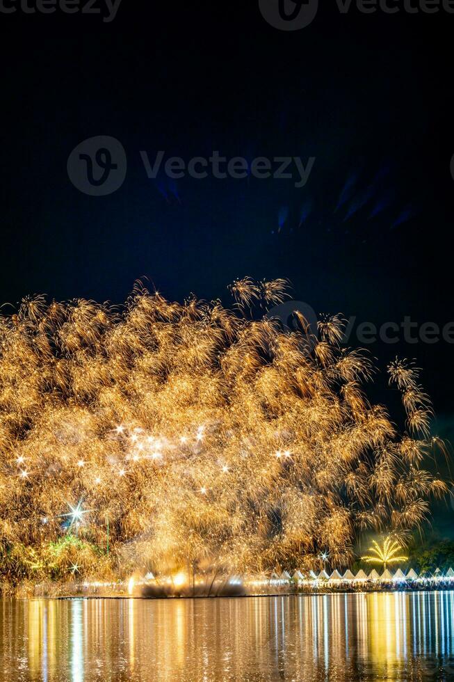 fireworks on the river in the dark sky photo