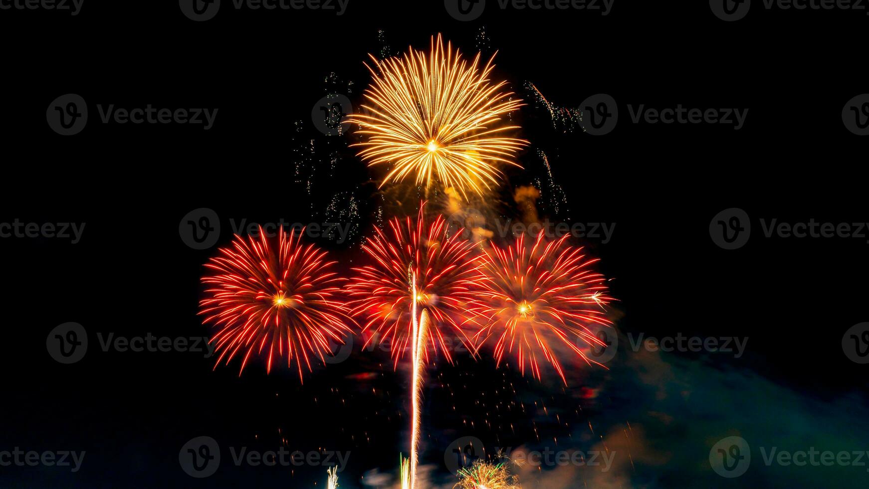 fireworks on the river in the dark sky photo