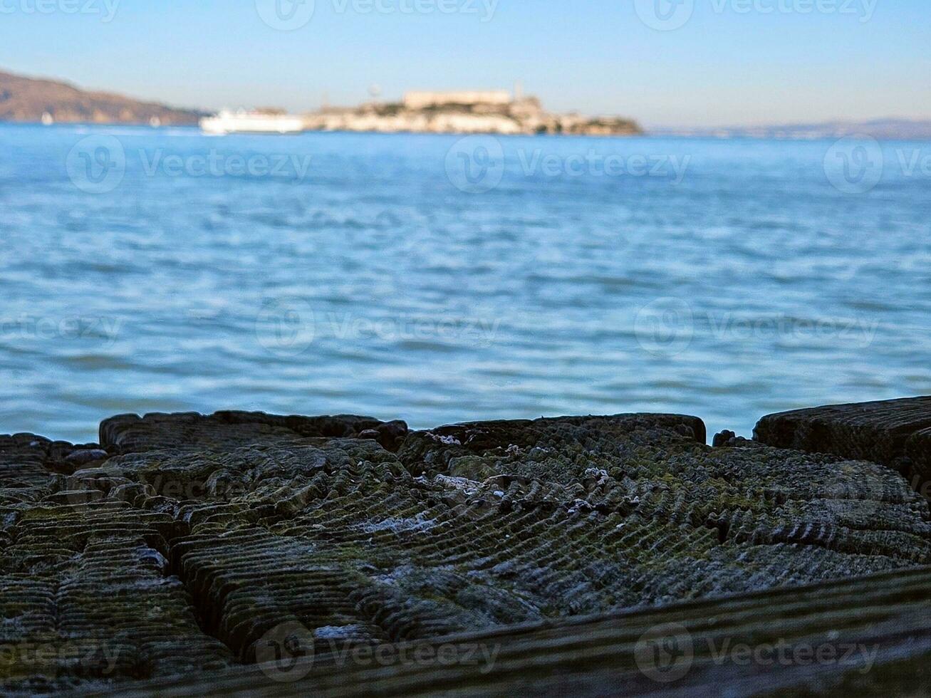 View of Alcatraz Island from Fort Mason port in San Francisco California photo