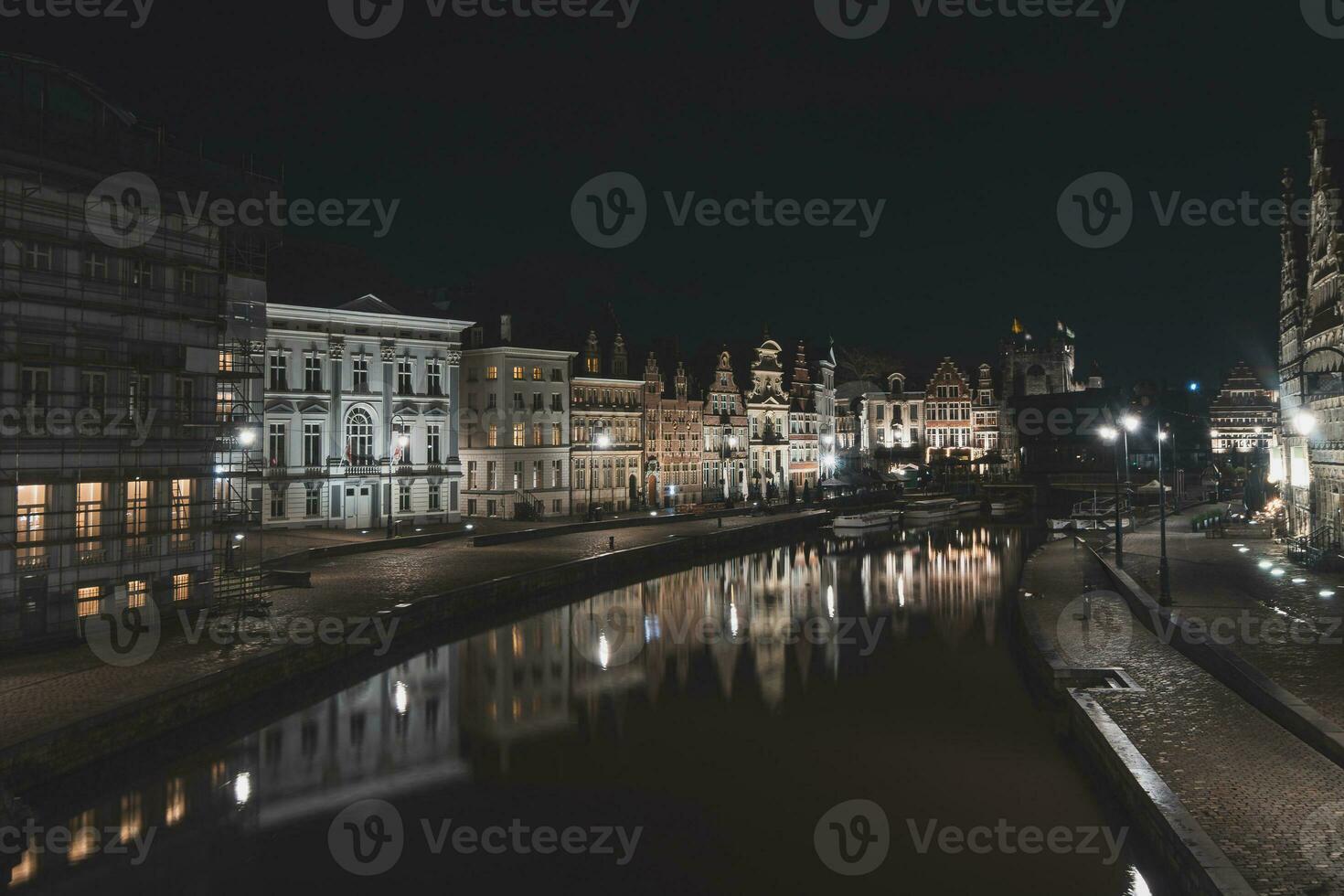 Medieval buildings on Graslei Street in the centre of Ghent by the River Leie during the night. Belgium's most famous historical centre. Ghent waterfront during midnight photo