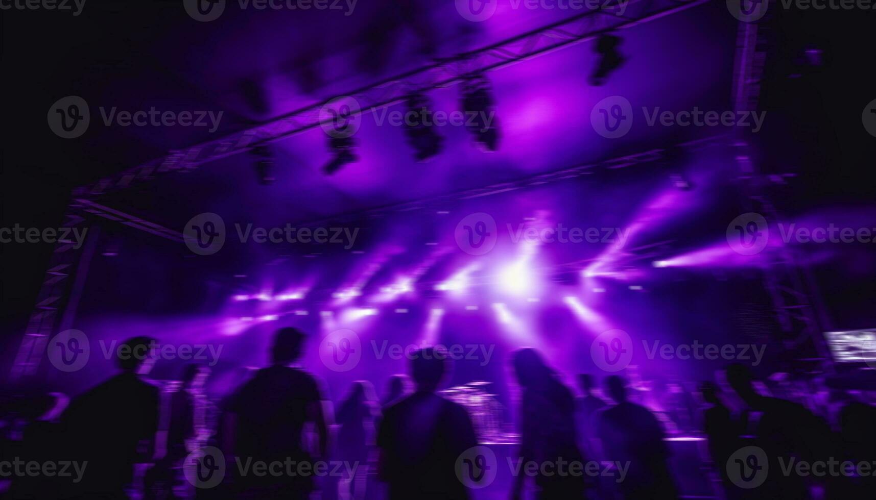 AI generated Nightclub stage illuminated with disco lights, crowd dancing generated by AI photo