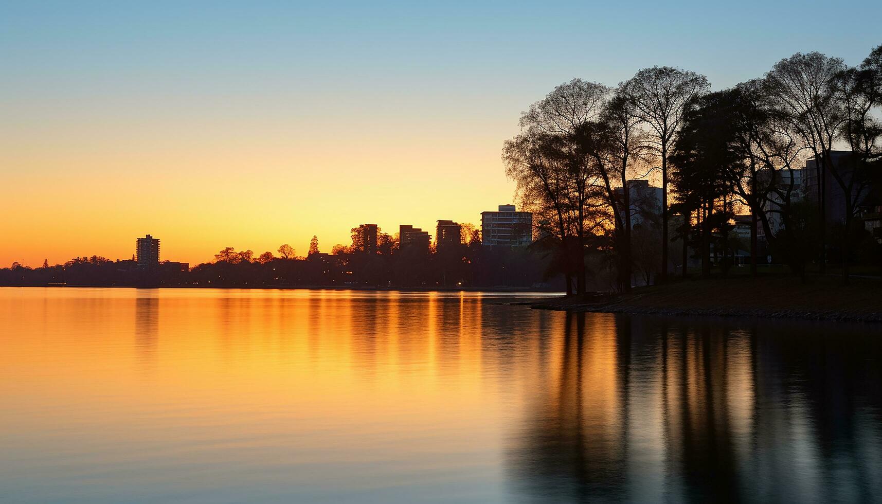 AI generated Silhouette of skyscrapers reflect on tranquil waterfront generated by AI photo