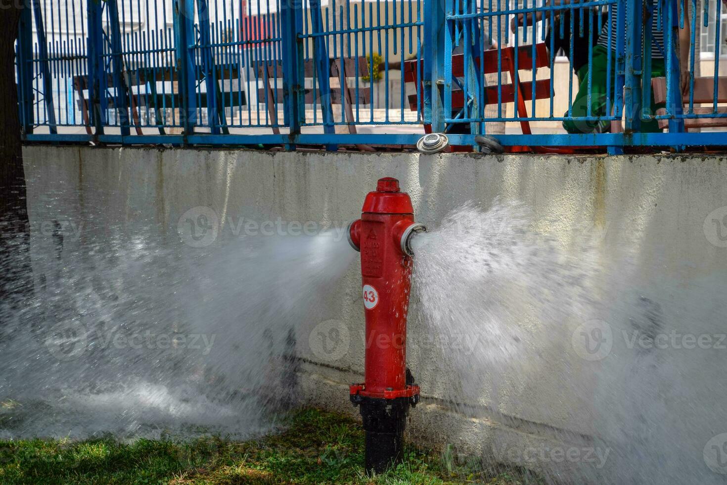 Open fire hydrant, water flows from a fire hydrant. photo