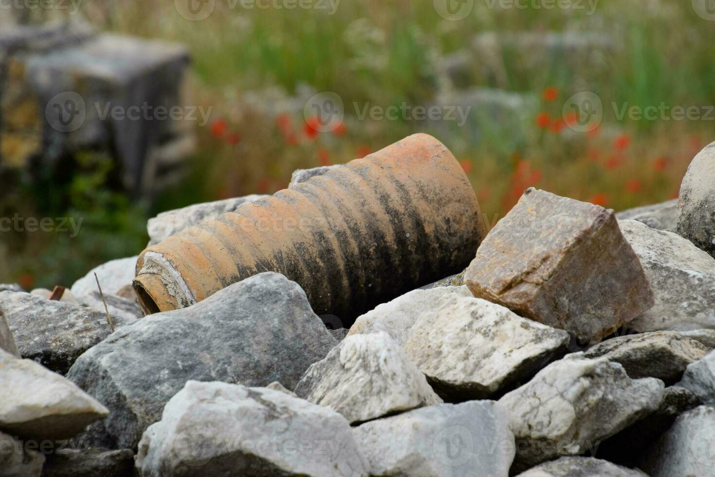 remains of ancient ceramic pipes from the water supply. Prefabricated sections of ceramics from which the pipeline was assembled. photo