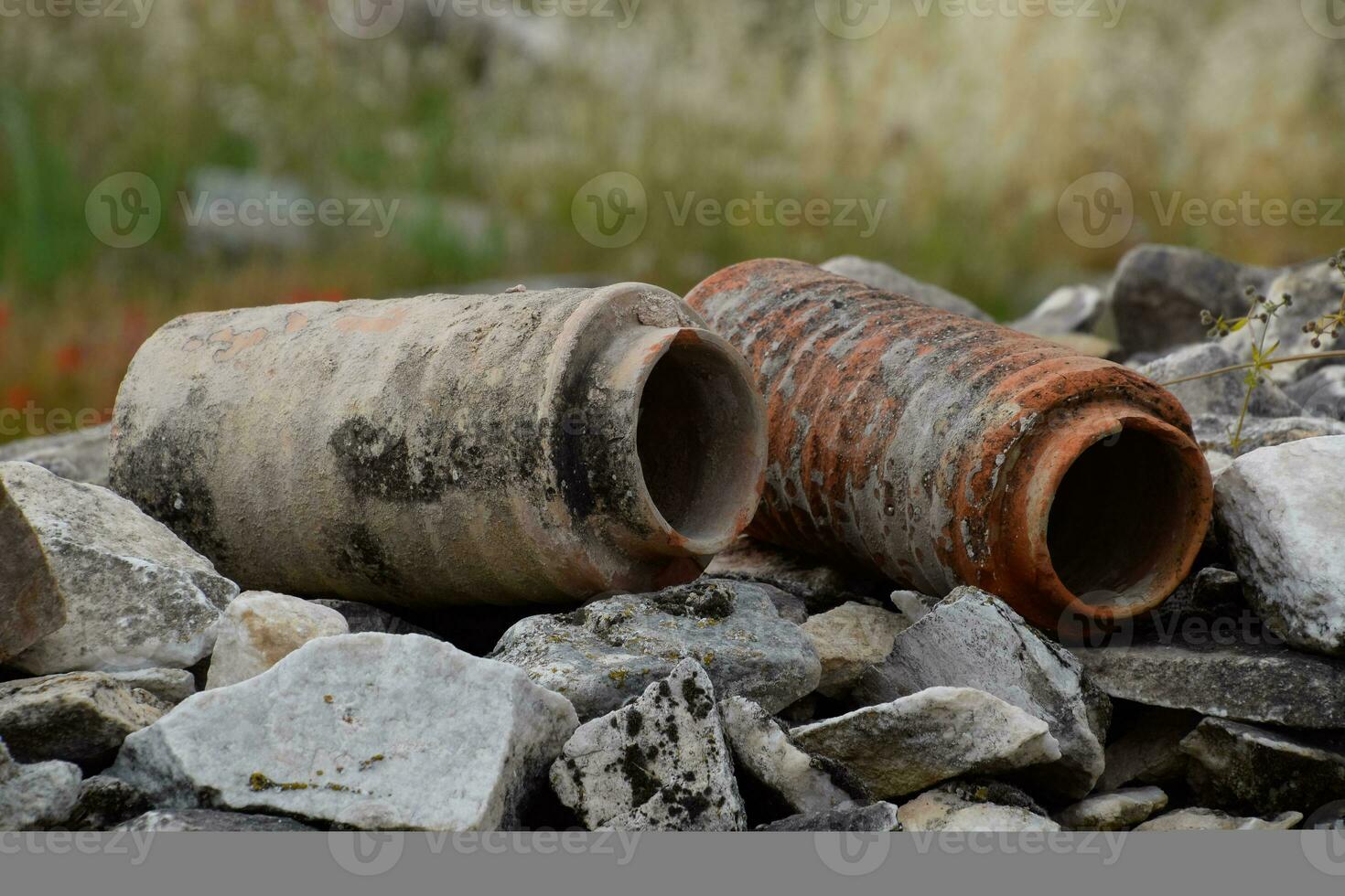 remains of ancient ceramic pipes from the water supply. Prefabricated sections of ceramics from which the pipeline was assembled. photo