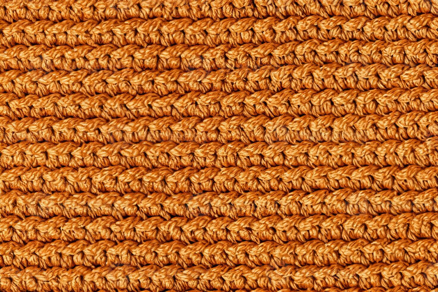 Orange knitted fabric texture background. Top view. Copy, empty space for text photo