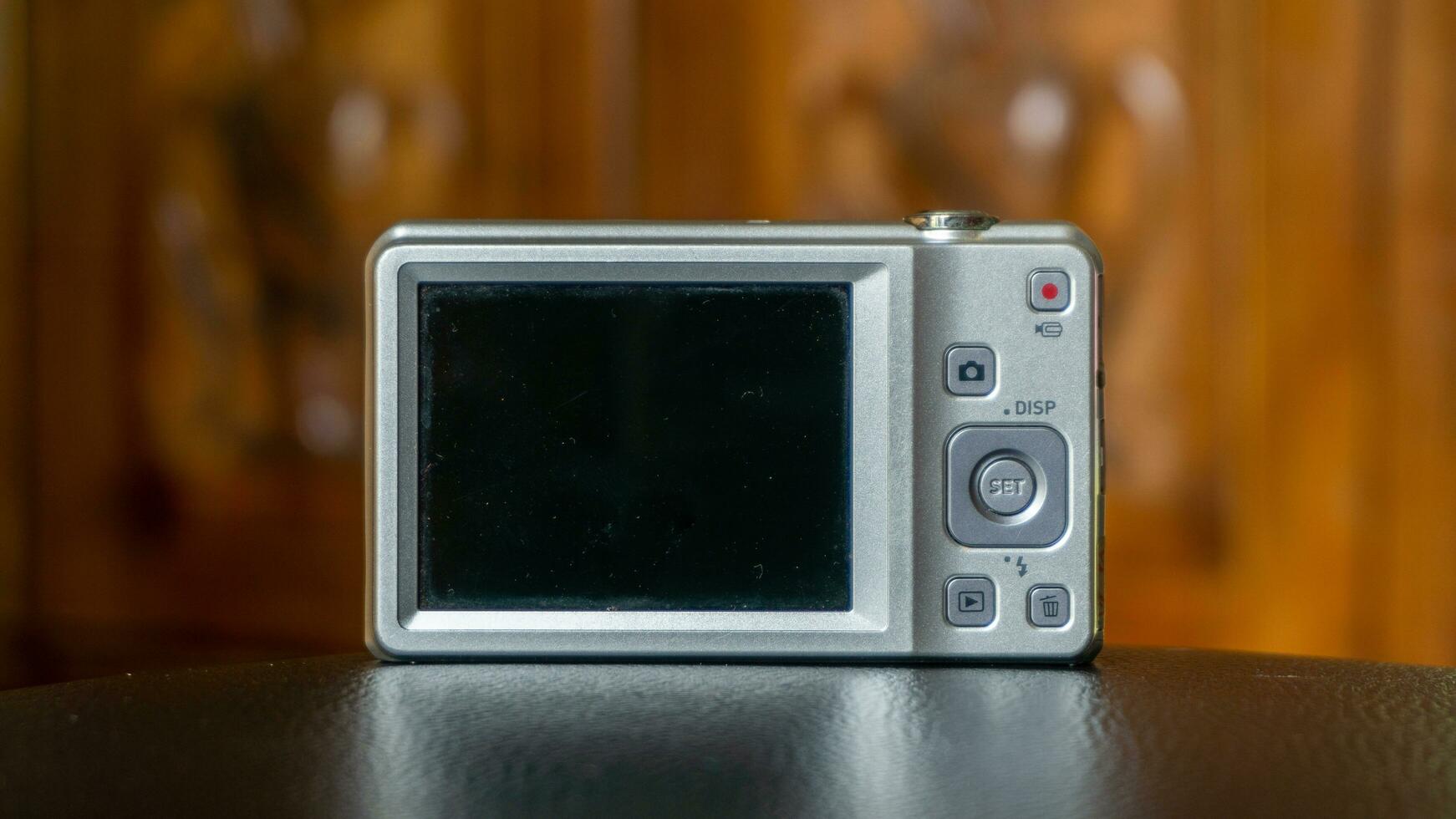 screen display of silver digital pocket camera photo