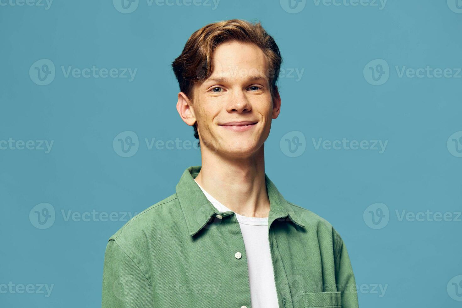 Stylishly Confident Caucasian Man with a Charming Smile in a Casual Studio Portrait photo