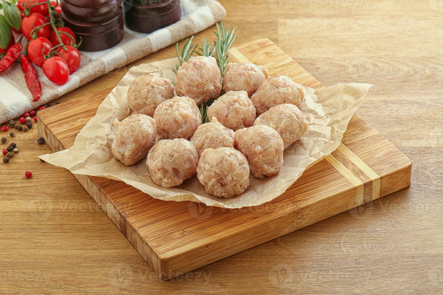 Raw chicken meatballs for cooking photo