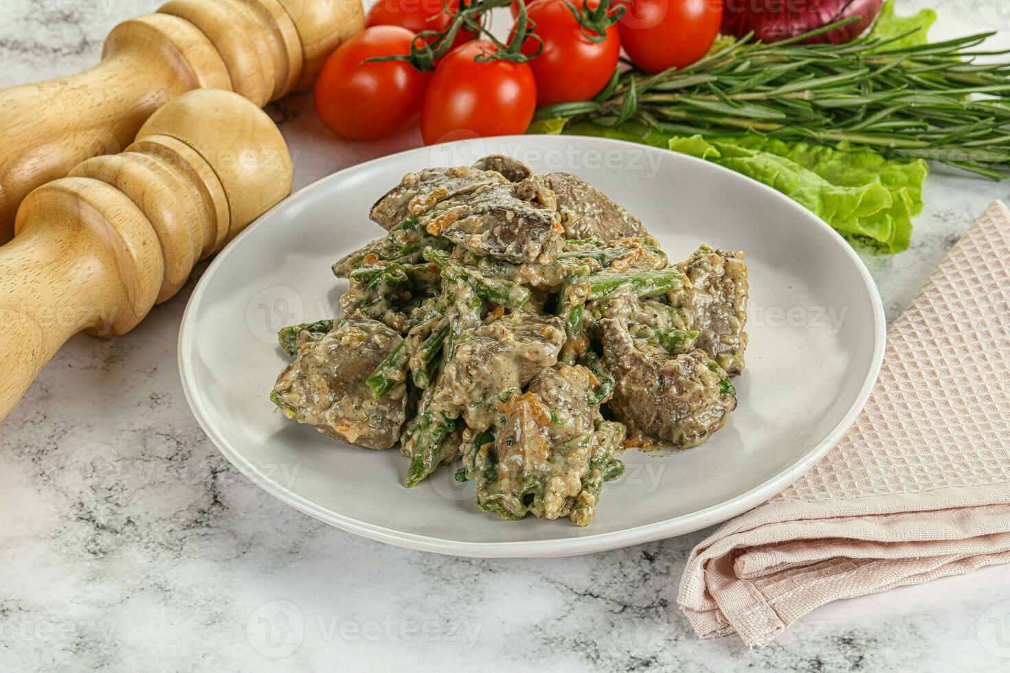 Fried turkey liver with herbs in cream sauce photo