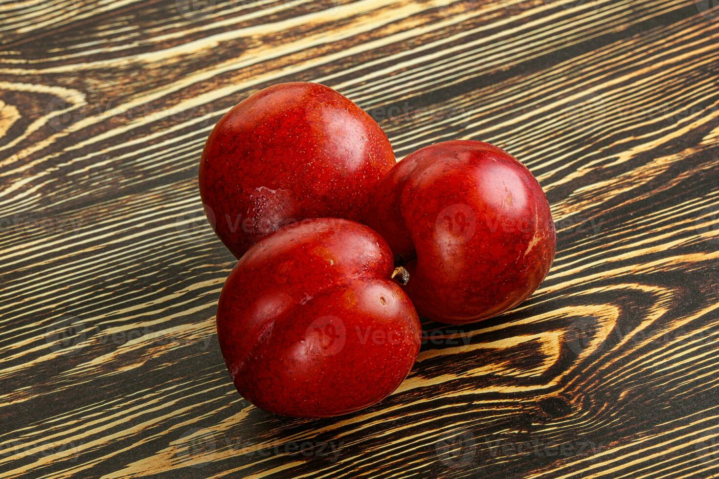 Ripe sweet juicy red plum photo