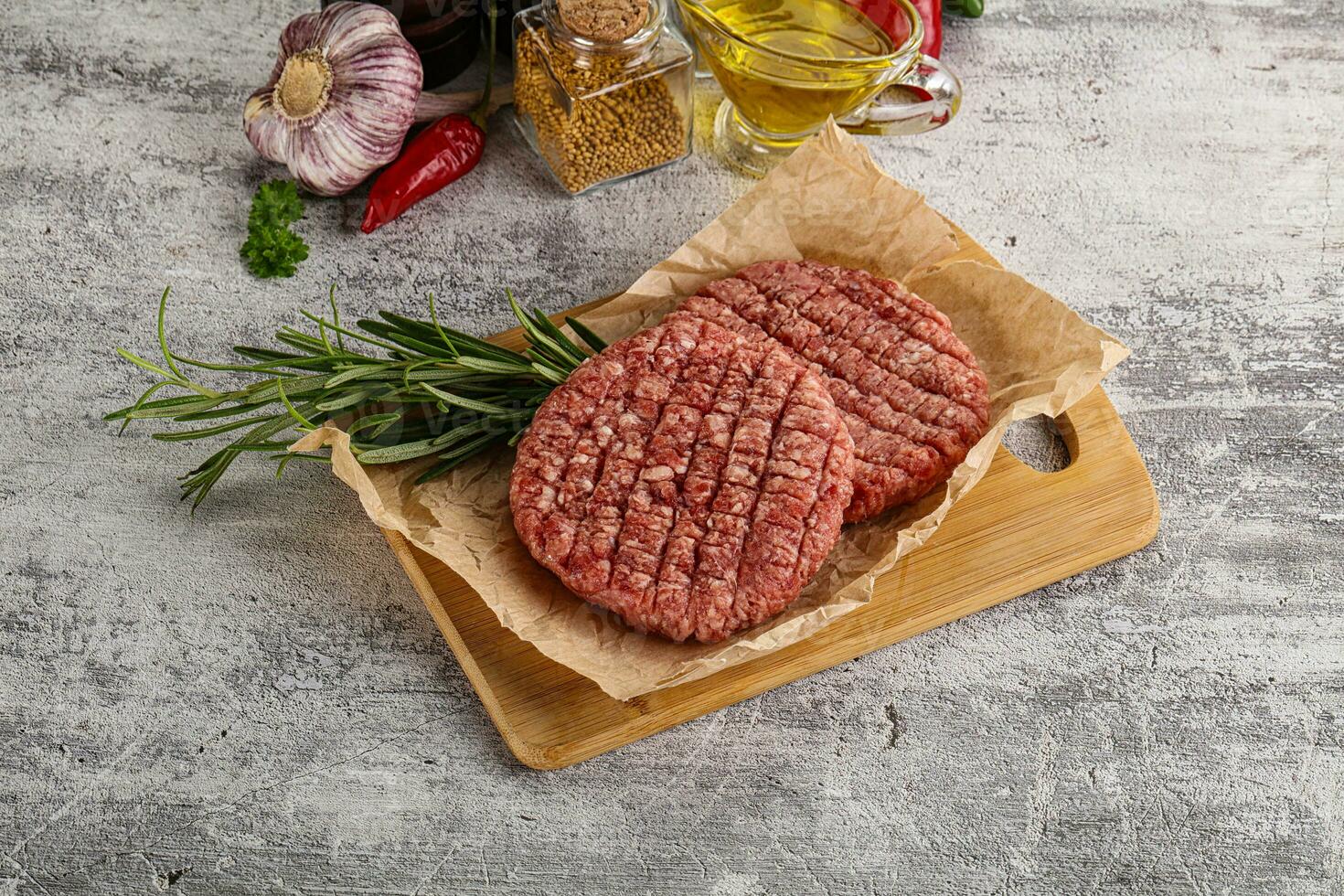 Raw burger cutlet for grill photo