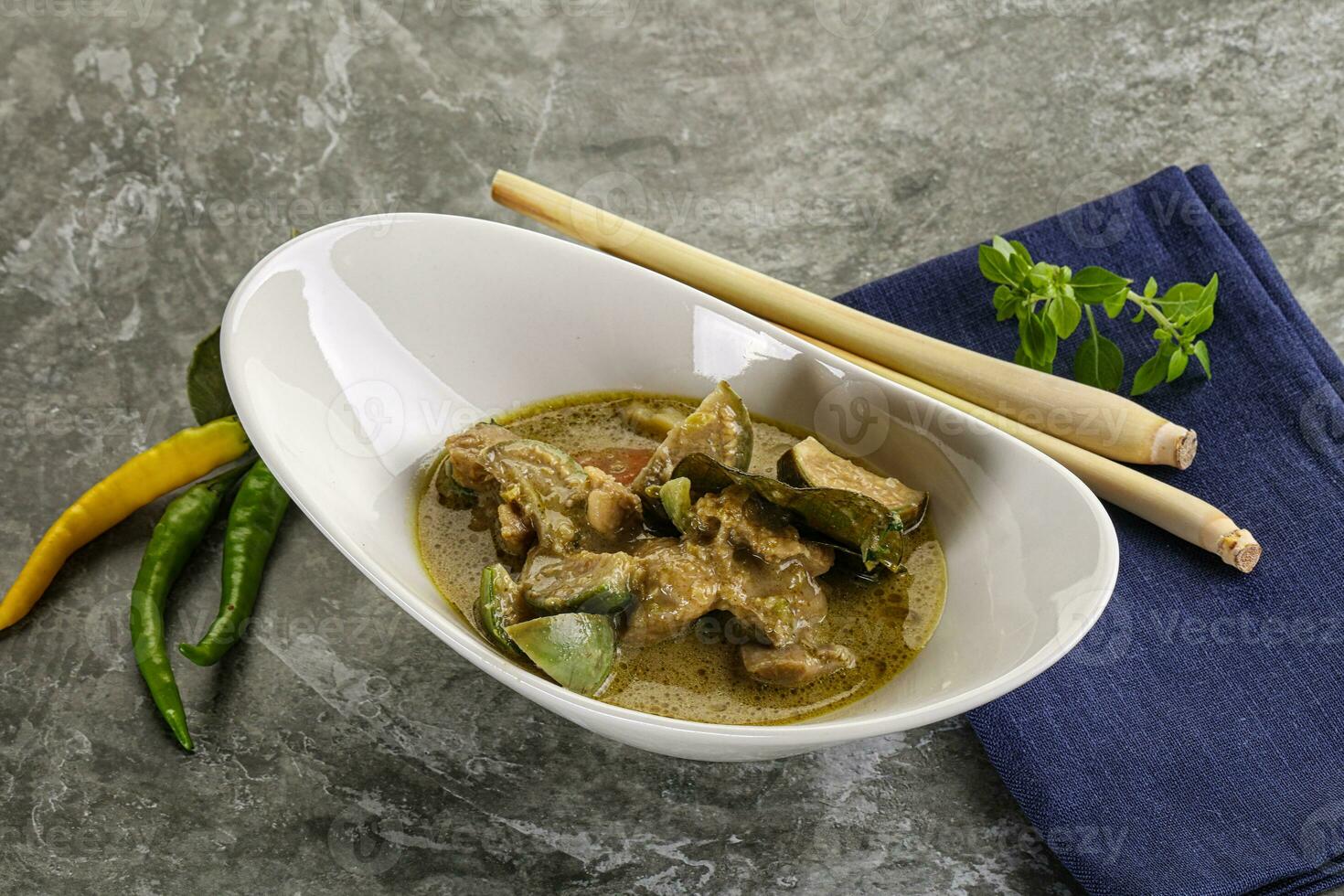 Thai green curry soup with basil photo