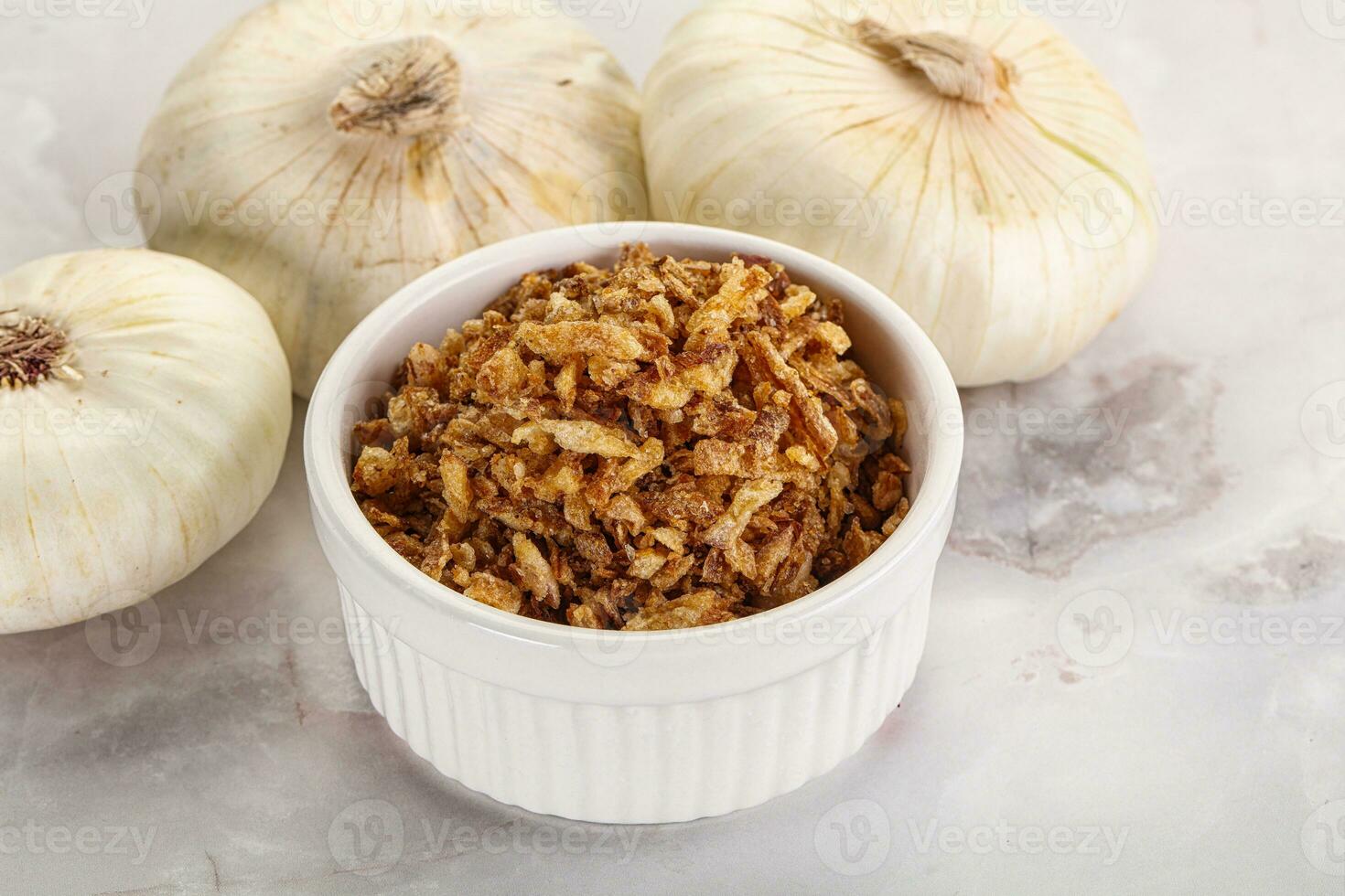 Dried roasted onion flakes for culinary photo