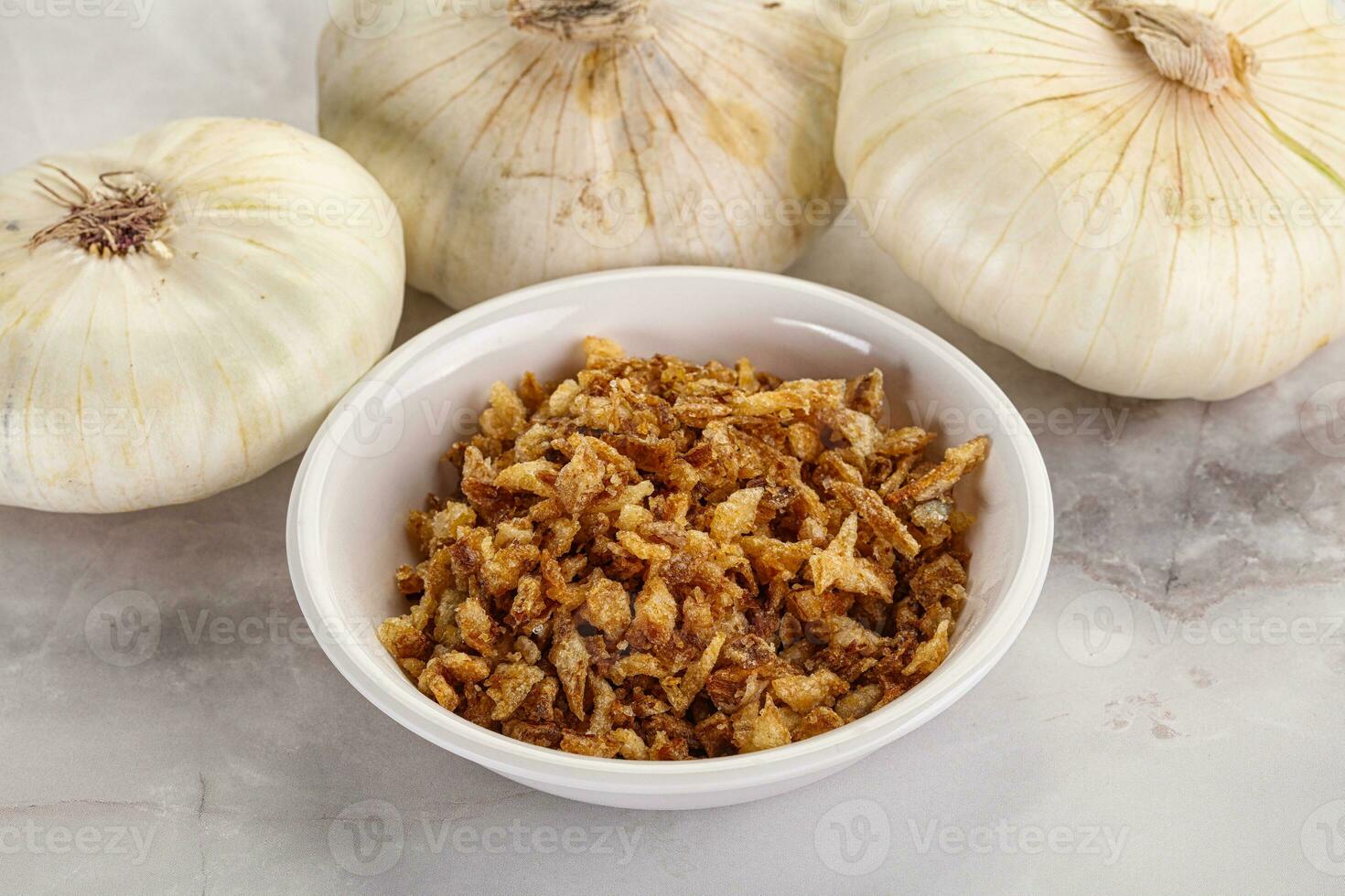 Dried roasted onion flakes for culinary photo