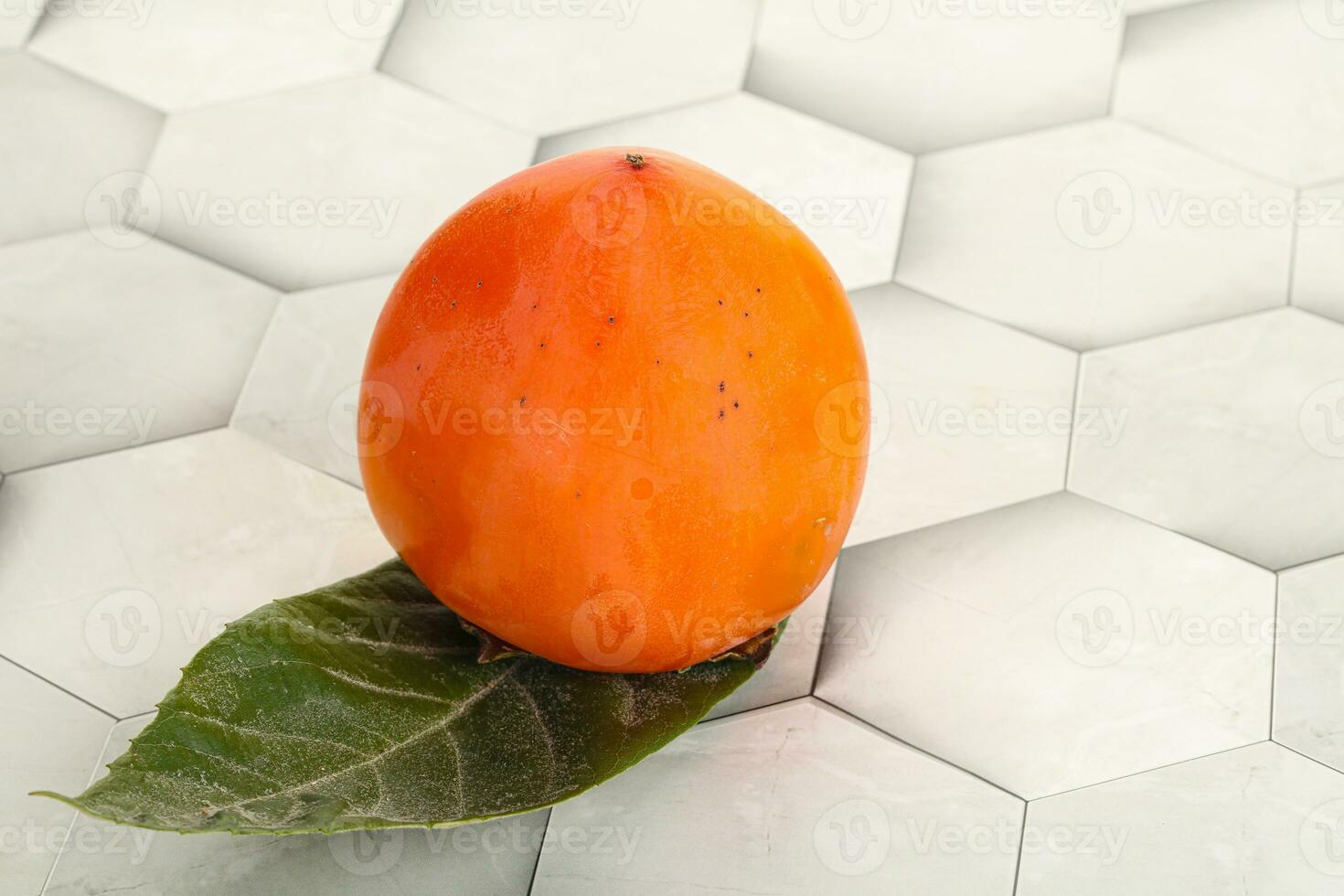Fresh ripe sweet juicy persimmon photo