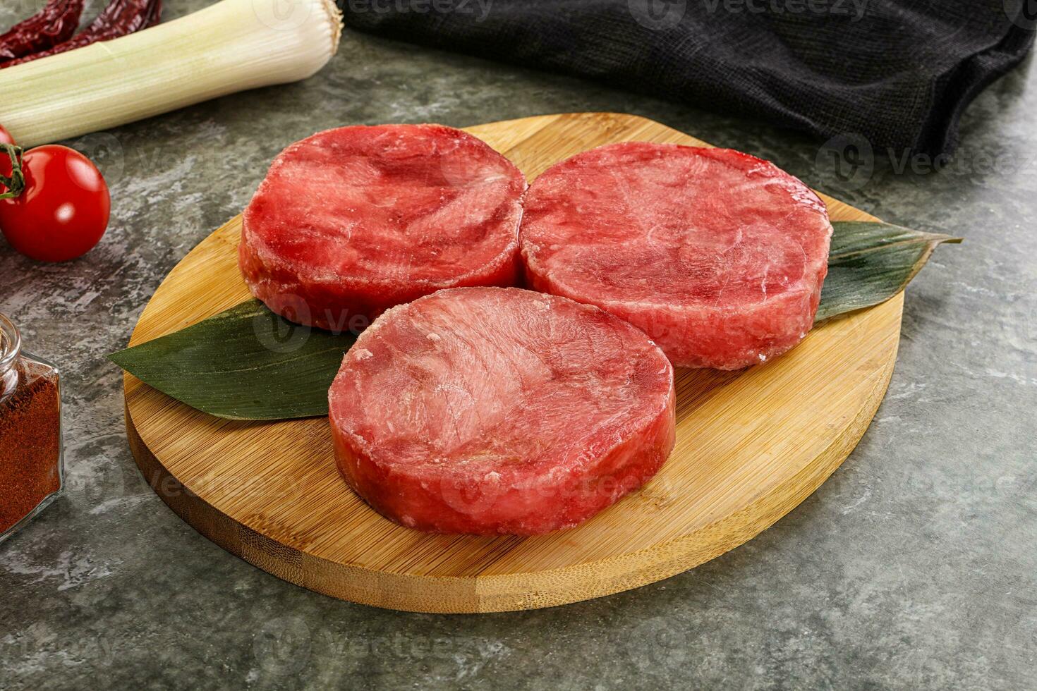 Delicous raw tuna medallion for cooking photo