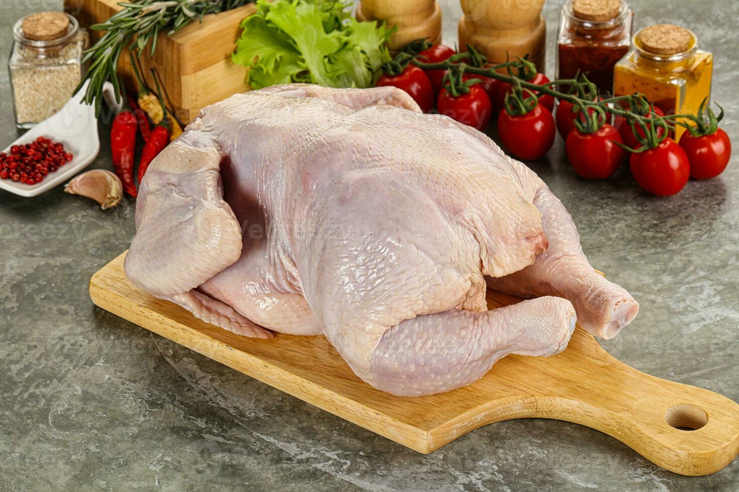 Raw whole chicken for cooking photo