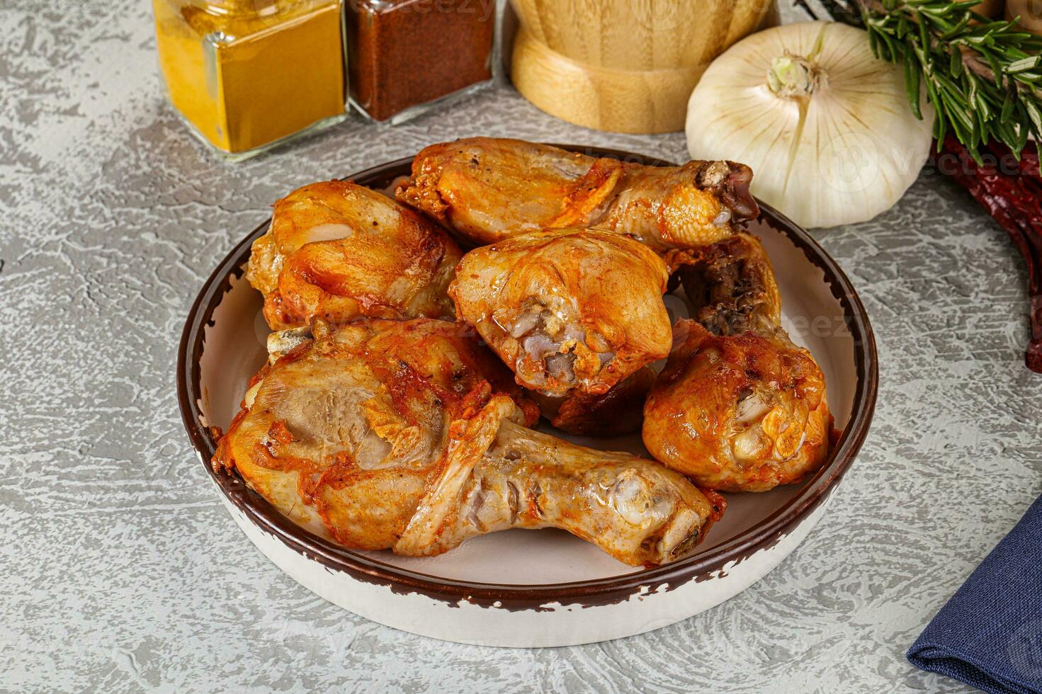 Raw marinated chicken drumstick for cooking photo