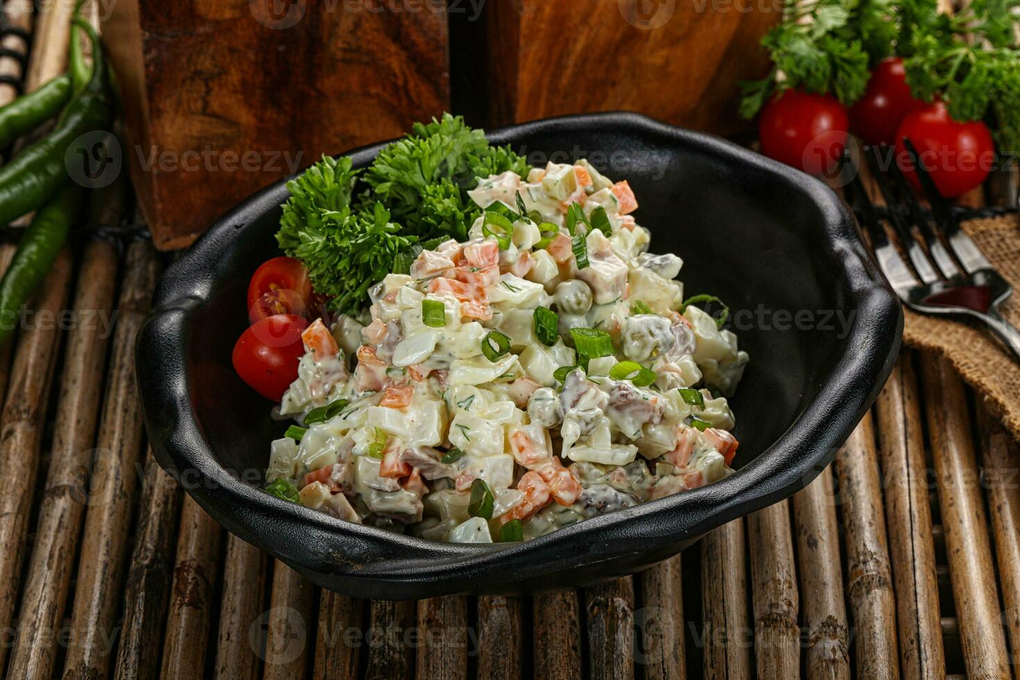 Traditional Russian salad with mayonnaise photo