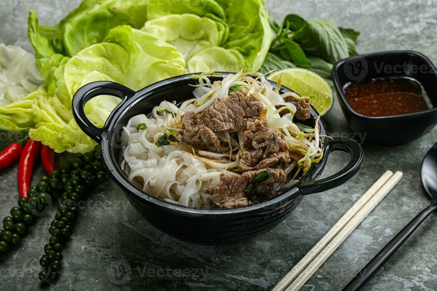 Vietnamese traditional soup Pho Bo with beef photo