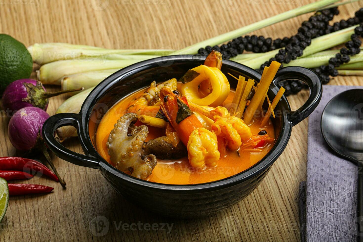 Thai Tom Yum soup with seafood photo