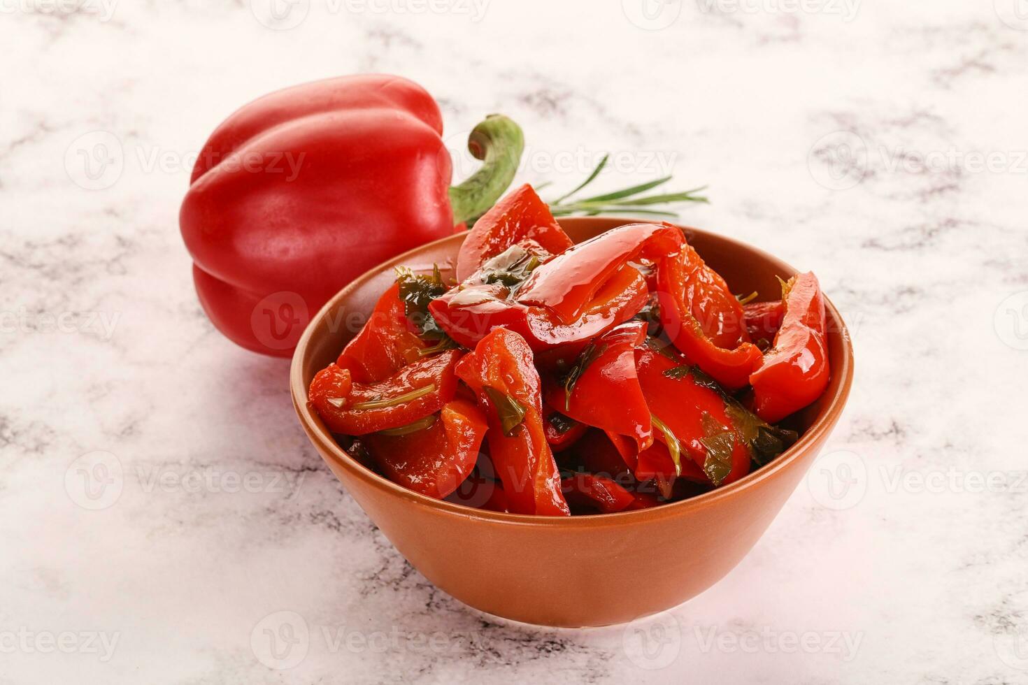 Pickled red bell pepper in the bowl photo