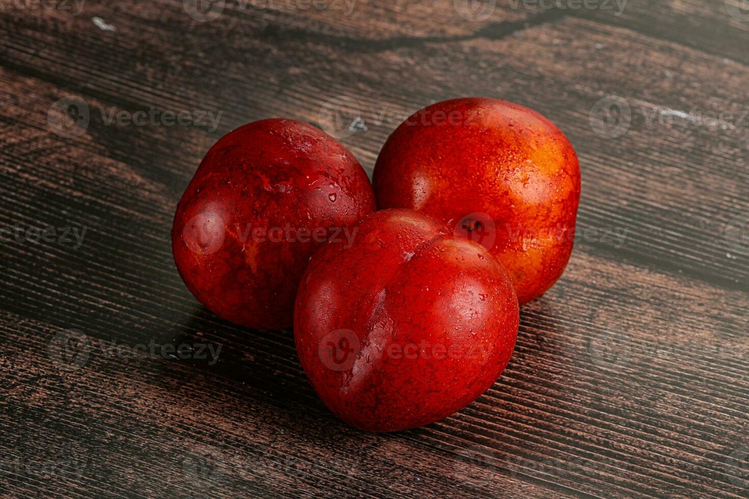 Ripe sweet juicy red plum photo