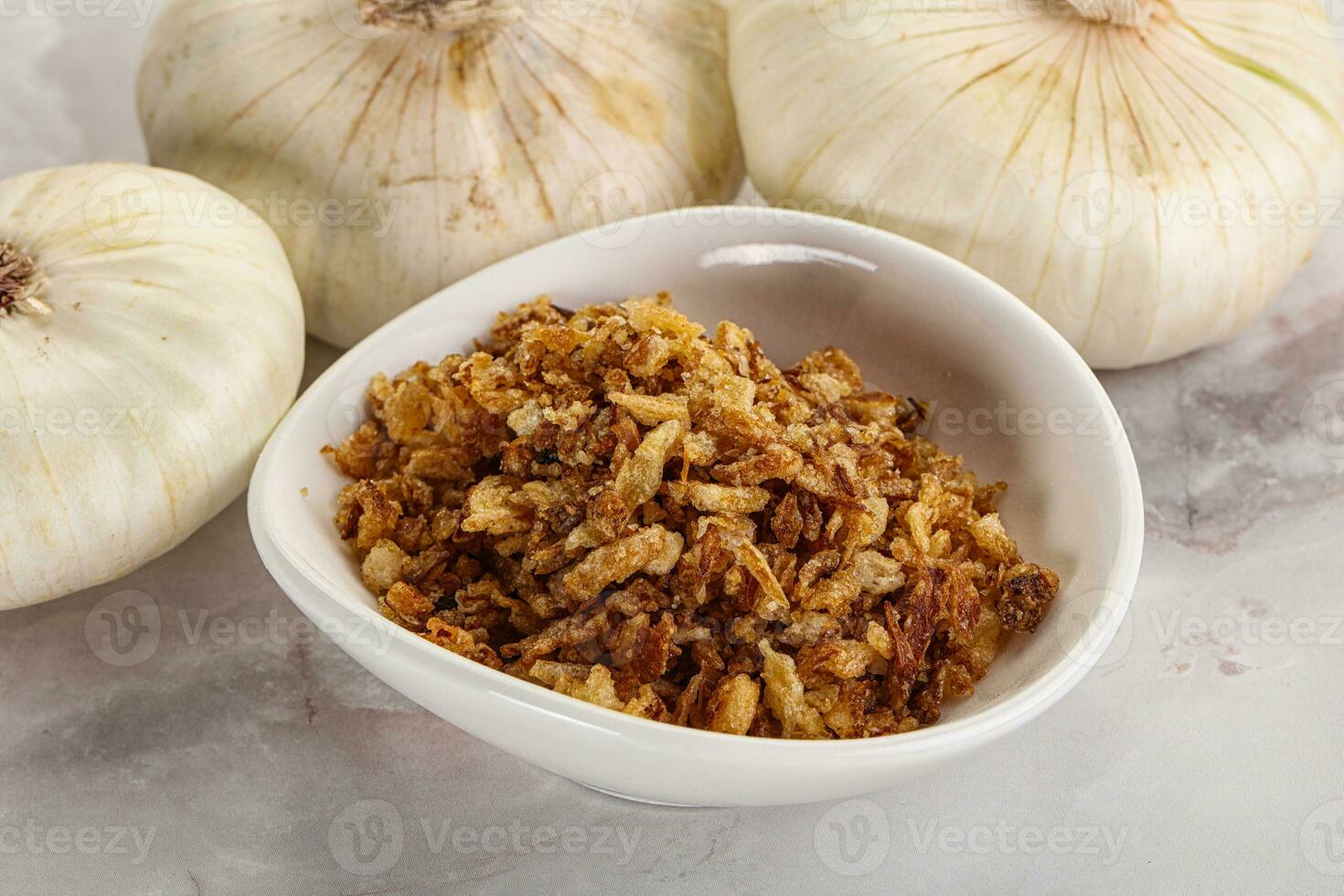 Dried roasted onion flakes for culinary photo