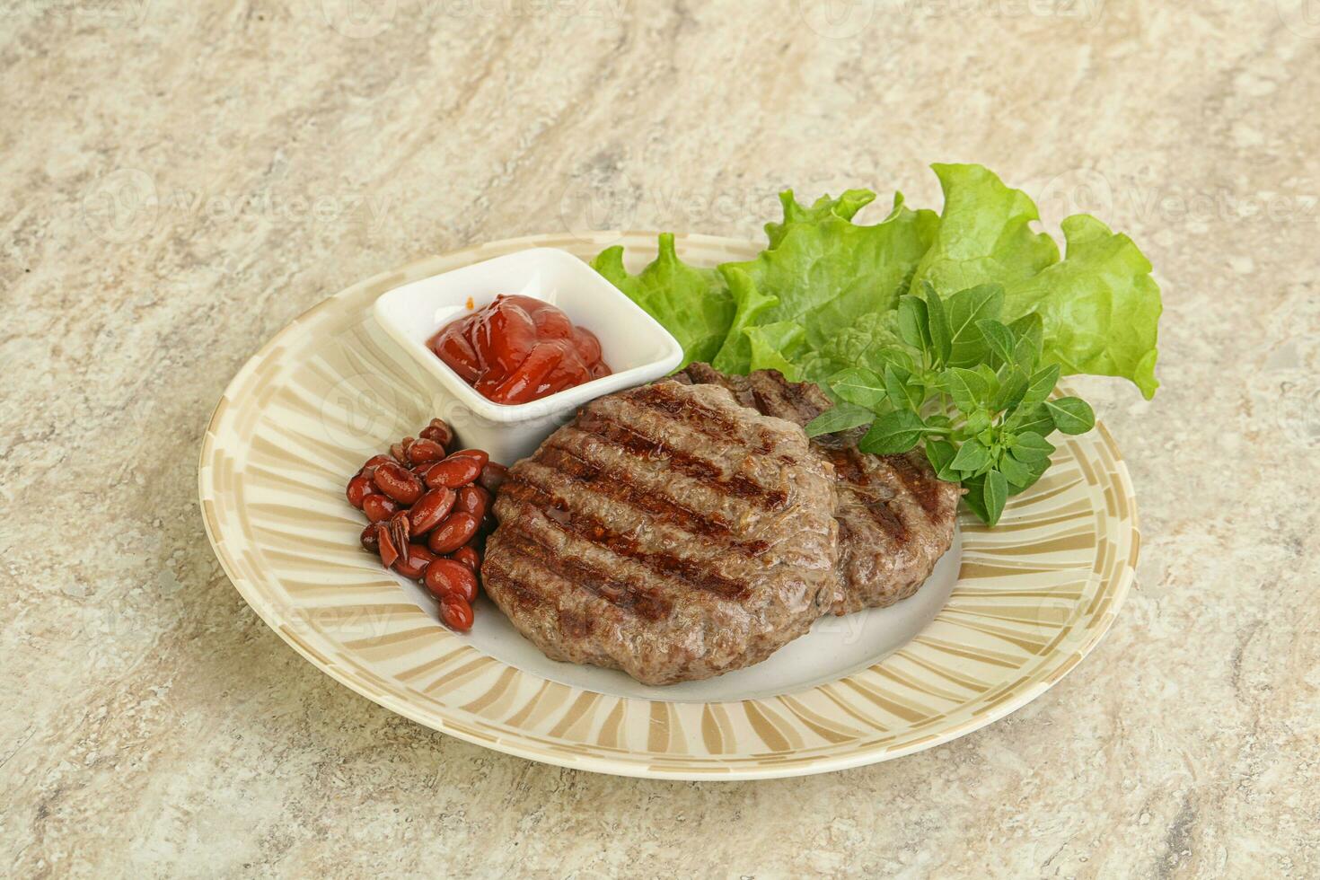Grilled beef burger cutlet with sauce photo