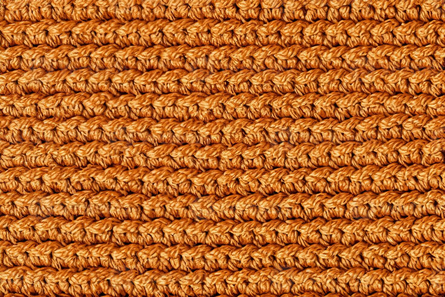 Orange knitted fabric texture background. Top view. Copy, empty space for text photo