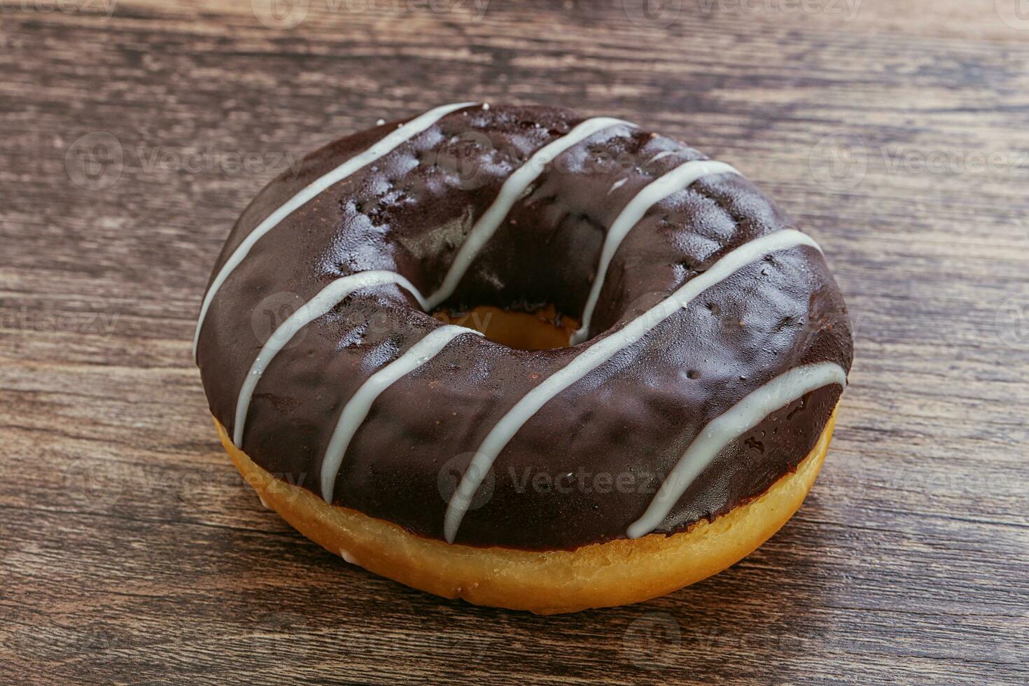 Glazed sweet tasty chocolate donut photo