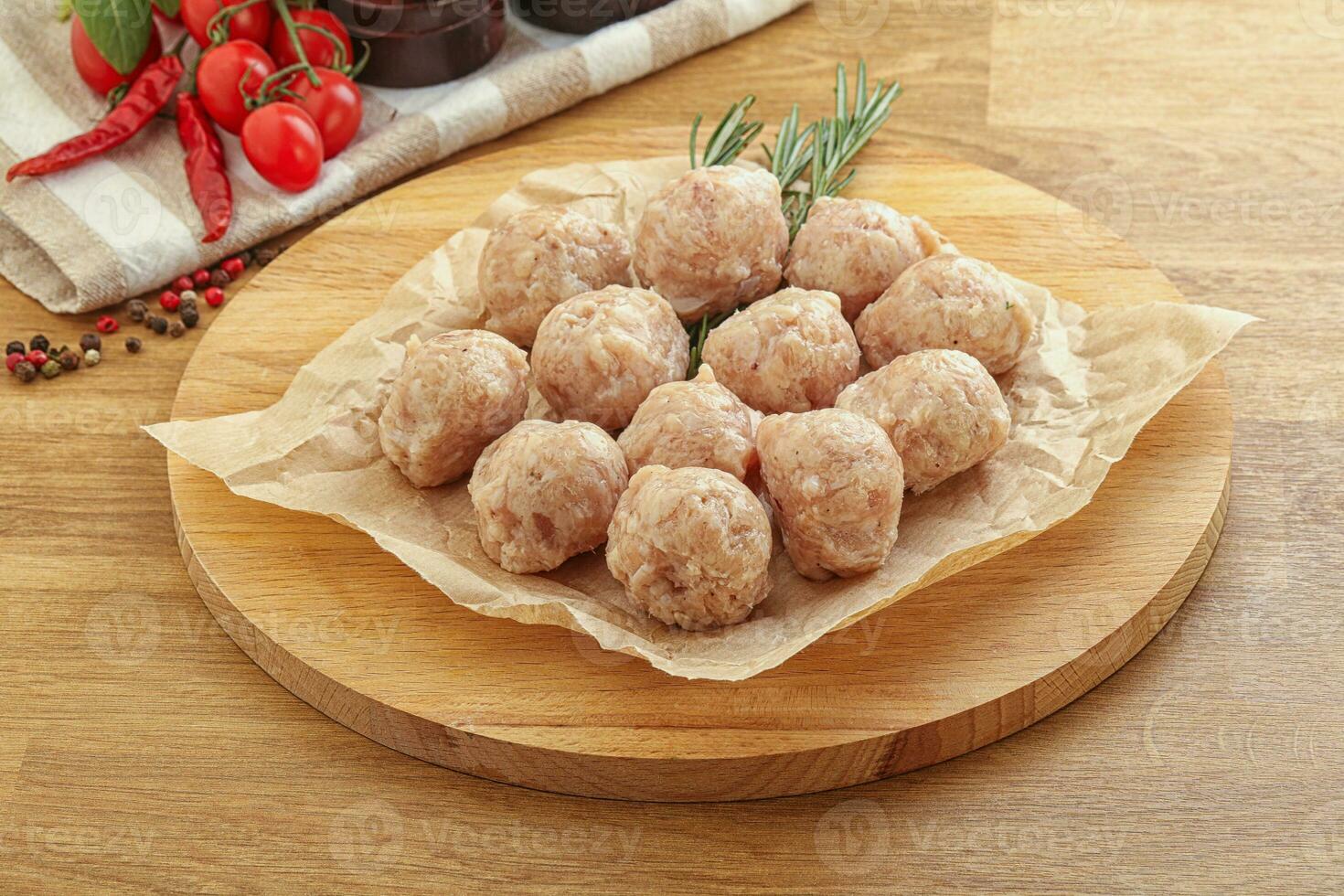 Raw chicken meatballs for cooking photo