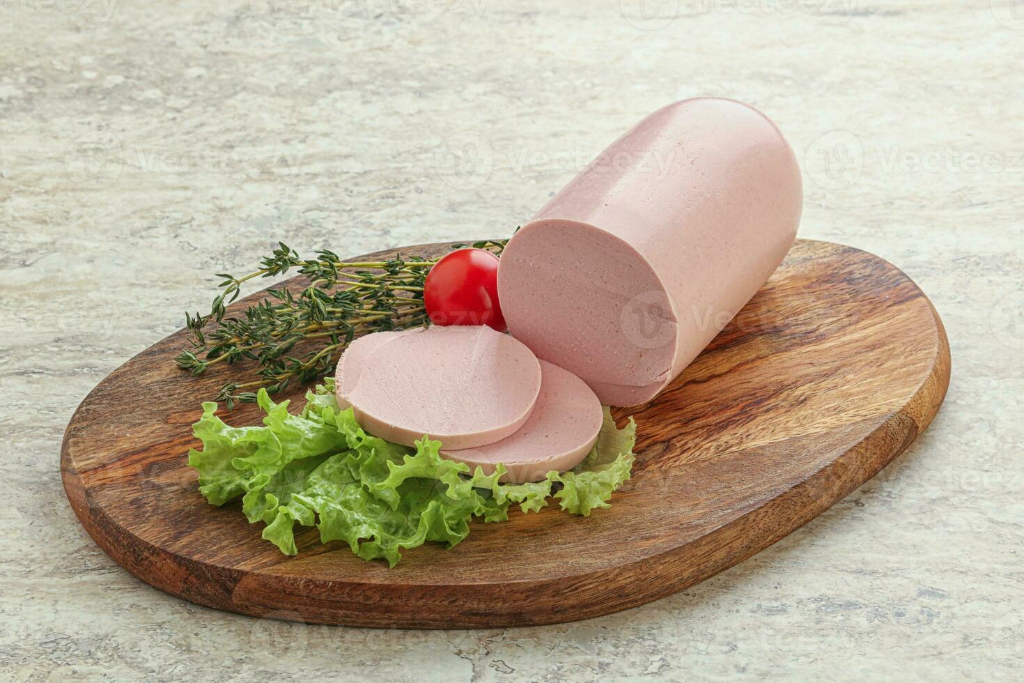 Boiled sausage with two slices photo