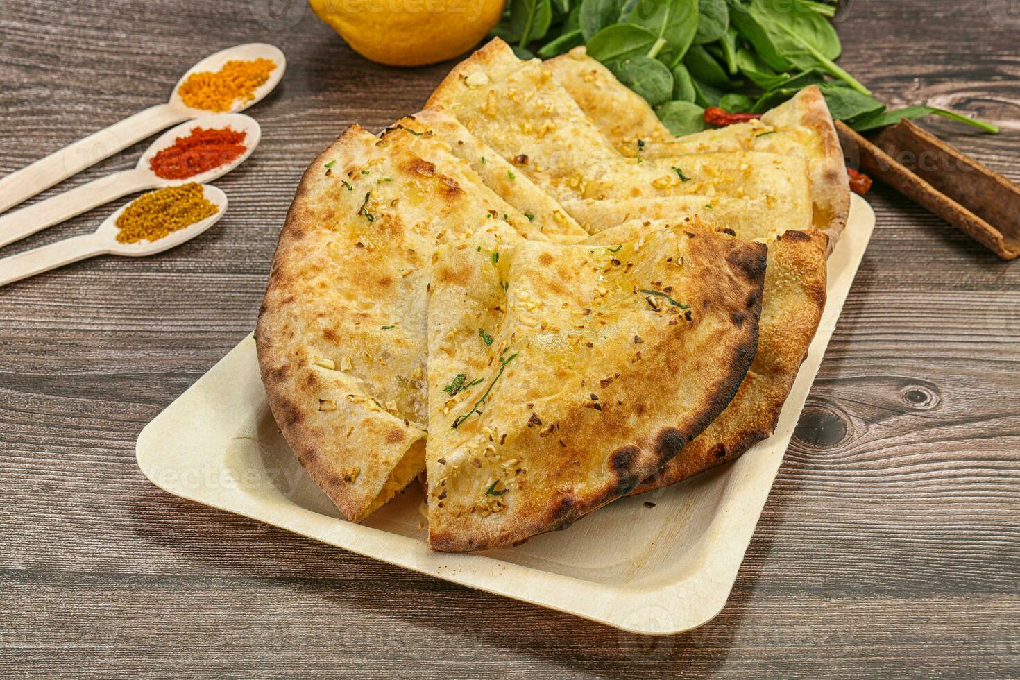 Indian tandoori bread - Garlic naan photo